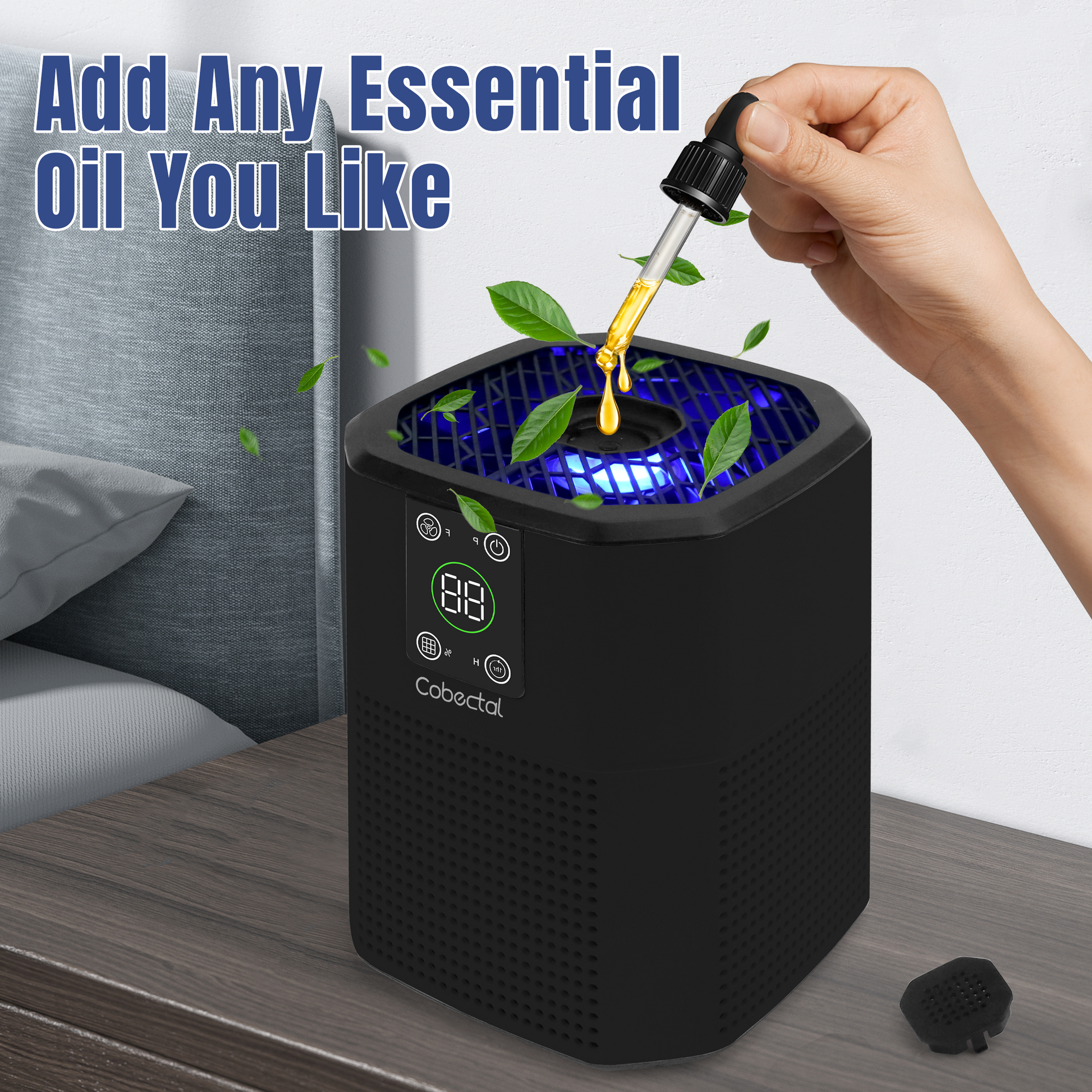 Cobectal ZQ2000C air purifier , add your favorite essential oils. Shown with a hand dropping oil into the top, blue light and leaves for a fresh, aromatic vibe. 